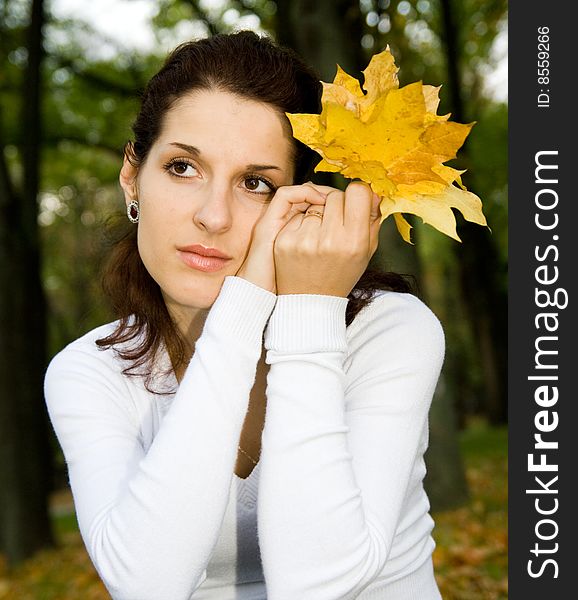 Portrait of cute girl with leaves