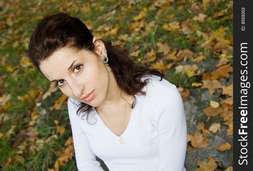 Portrait of beautiful girl in autumn