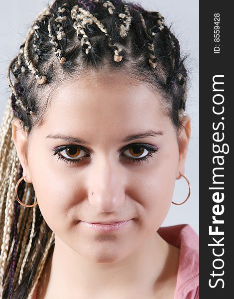 The nice girl with an ethnic dreadlocks hairdress. The nice girl with an ethnic dreadlocks hairdress