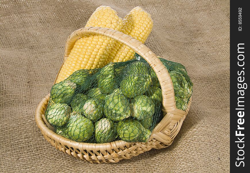 Brussels sprouts and maize-cob in a basket. Brussels sprouts and maize-cob in a basket