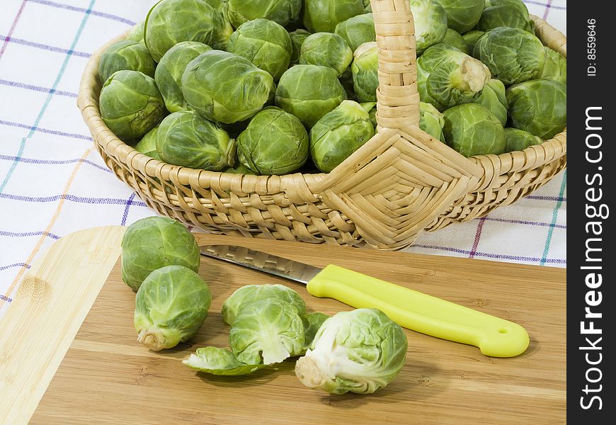 Preparation of brussels sprouts on a wooden plate