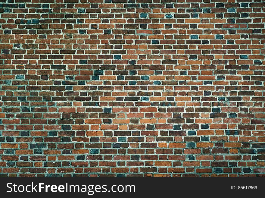Old wall of red bricks. Wallpaper of ordinary building wall texture.