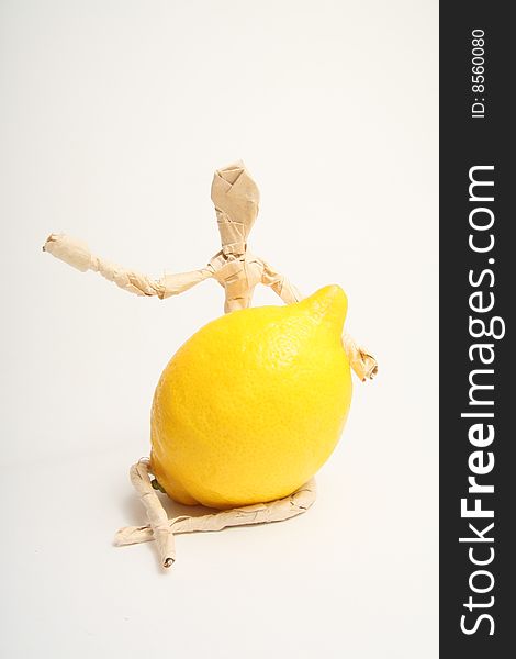Figure of paper man with lemon. Figure of paper man with lemon