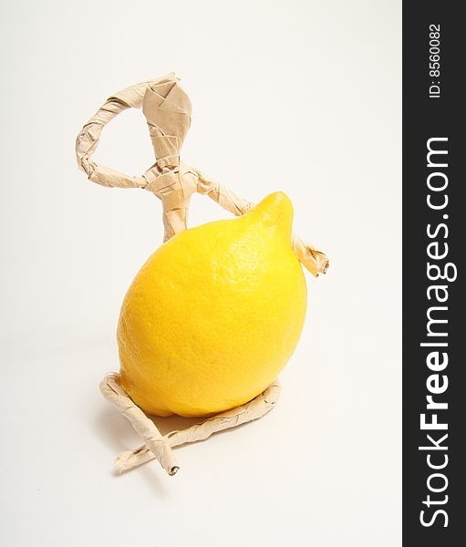 Figure of paper man with lemon. Figure of paper man with lemon