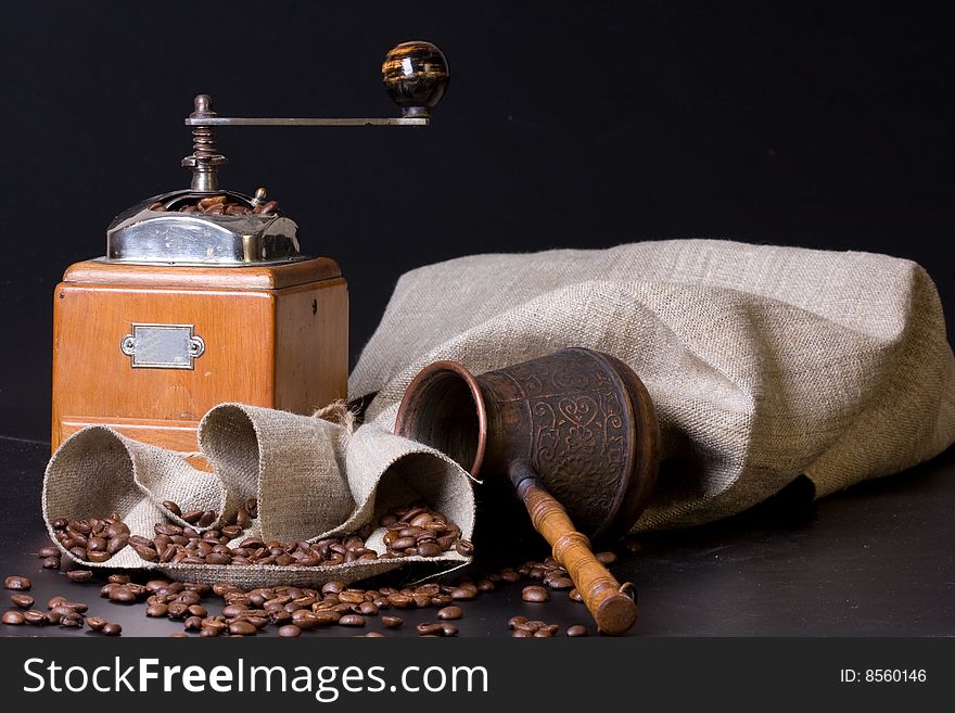 Retro coffee grinder on a black background