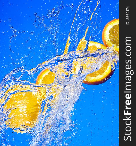 Orange with creative splashing water