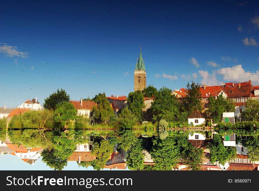 A reflection of the City of Telc, Southern Moravia, The Czech Republic, in lake that surrounds it. A reflection of the City of Telc, Southern Moravia, The Czech Republic, in lake that surrounds it.