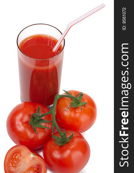 Fresh juicy tomatoes and tomato juice on a white background