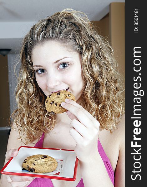 Girl eating chocolate cookie