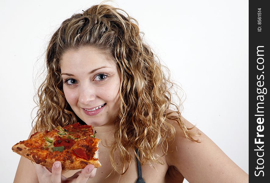 Girl eating pizza slice