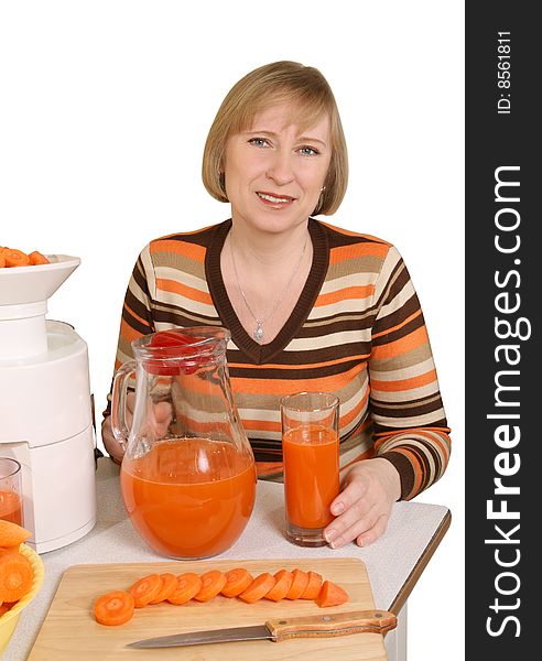 The woman has prepared for juice from carrots. The woman has prepared for juice from carrots