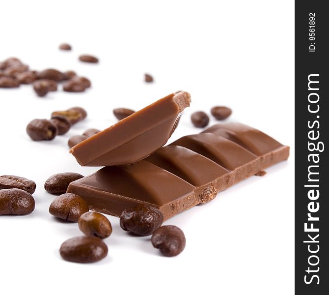 Chocolate and coffee beans on white background