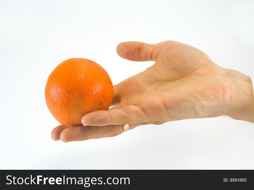 Mandarine in hands on a white background
