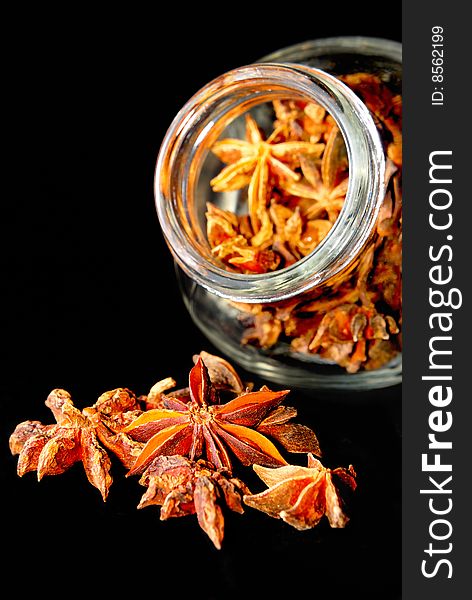 Anise Star in transparent container with black background. Anise Star in transparent container with black background