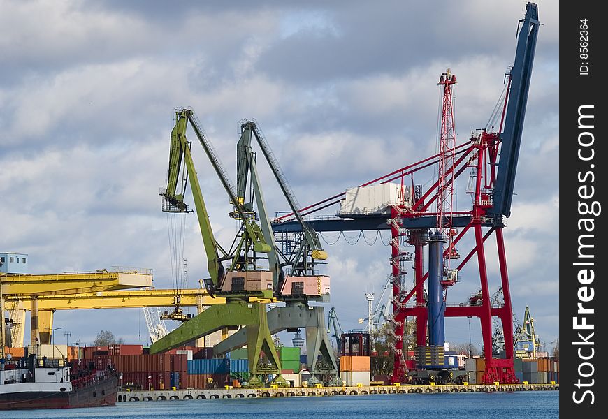 Gantry cranes and containers in a harbor. Gantry cranes and containers in a harbor