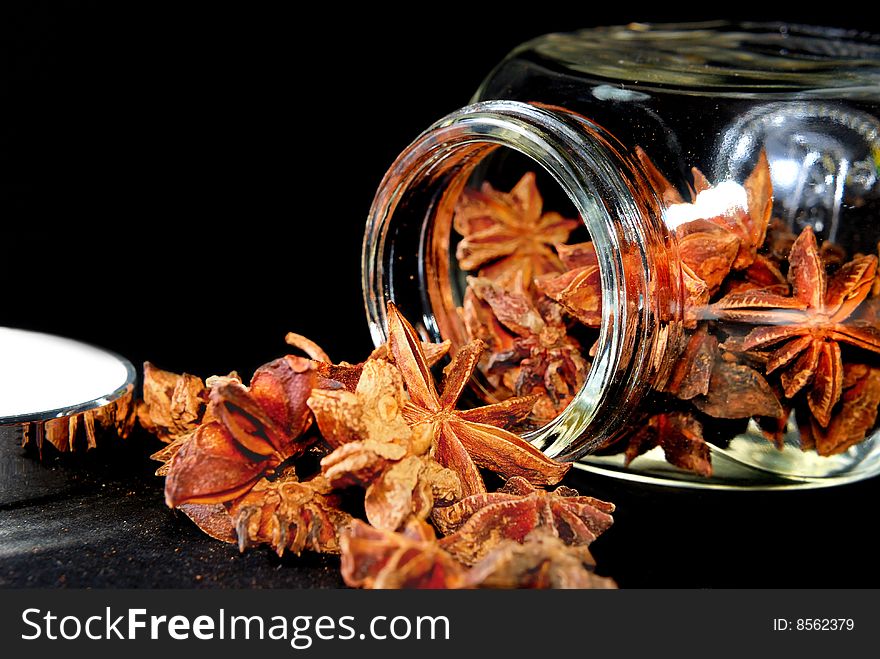 Anise Star in transparent container with black background. Anise Star in transparent container with black background