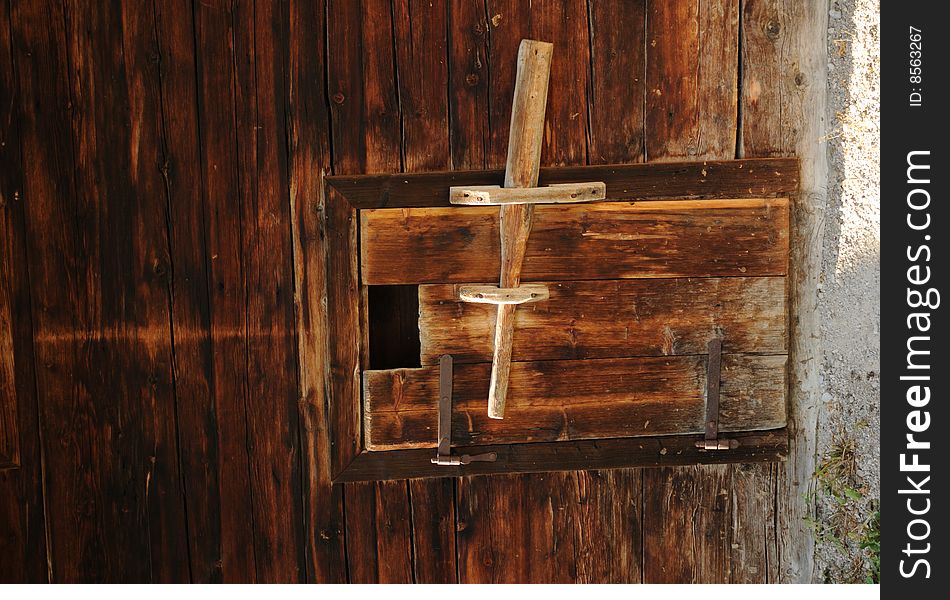 A wooden door at an alpine house. A wooden door at an alpine house.