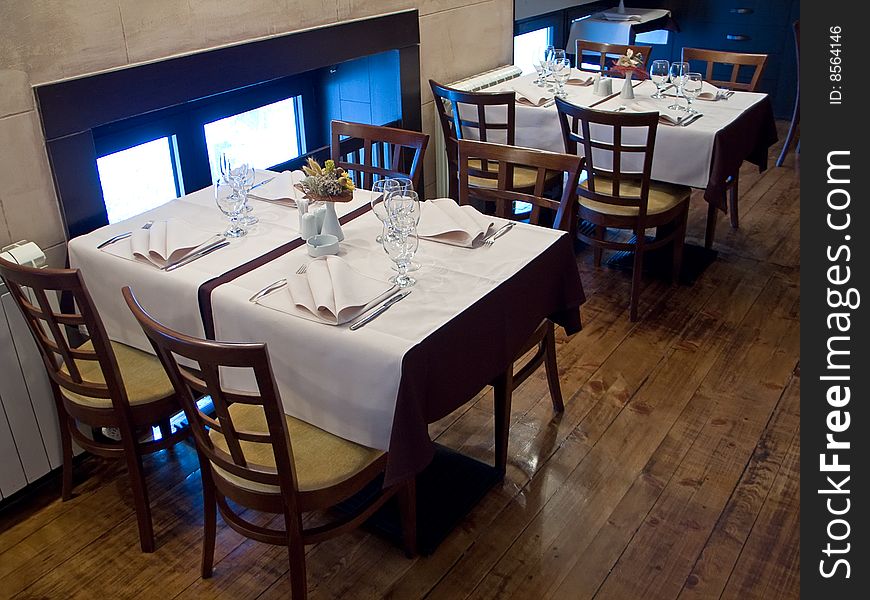 Tables with cutlery, plaits and glasses in Restaurant. Tables with cutlery, plaits and glasses in Restaurant