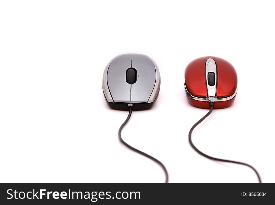 Red and grey computer mouses over white background. Red and grey computer mouses over white background