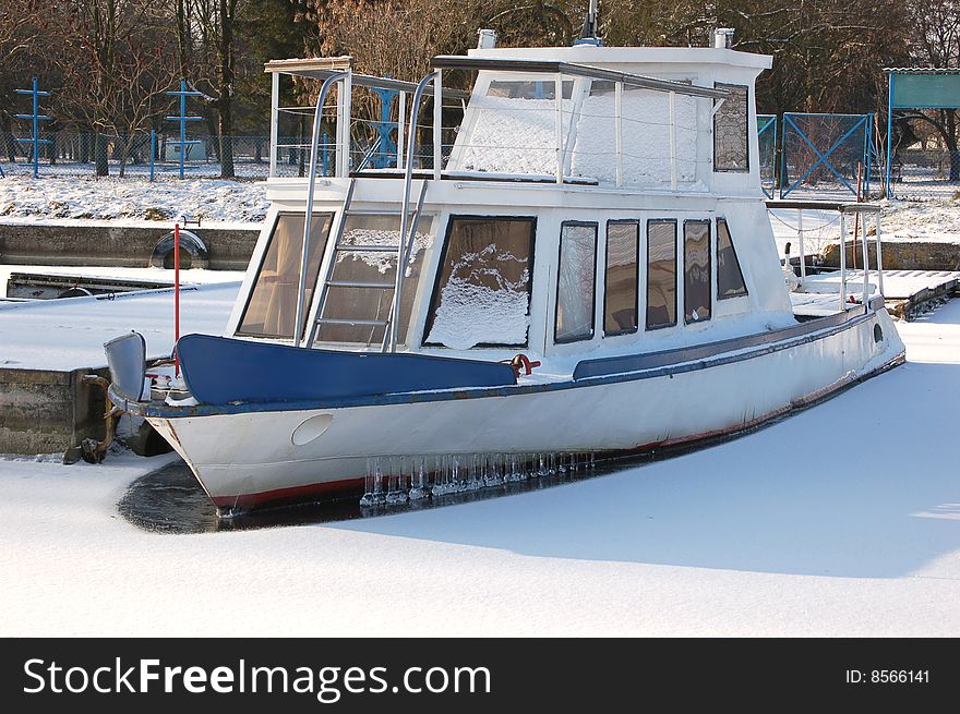 Ship frozen in ice on lake. Ship frozen in ice on lake