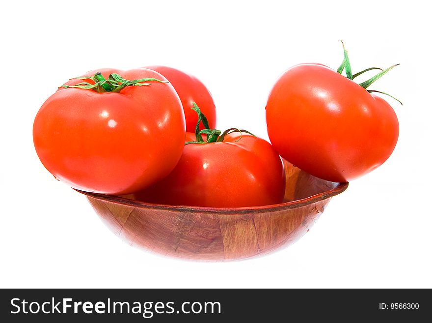 Several red and big tomato in bowl. isolated.