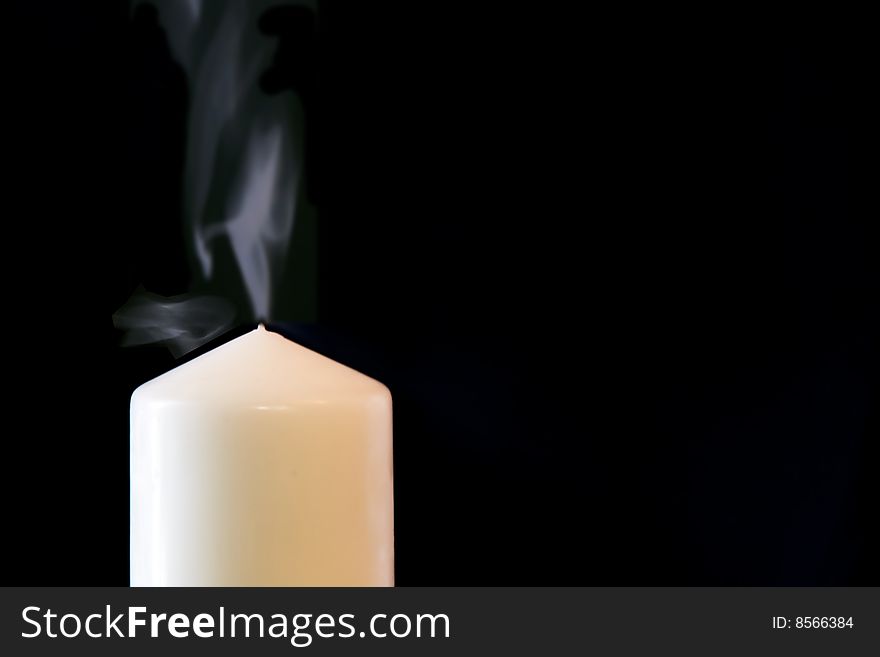 Candle isolated on black background