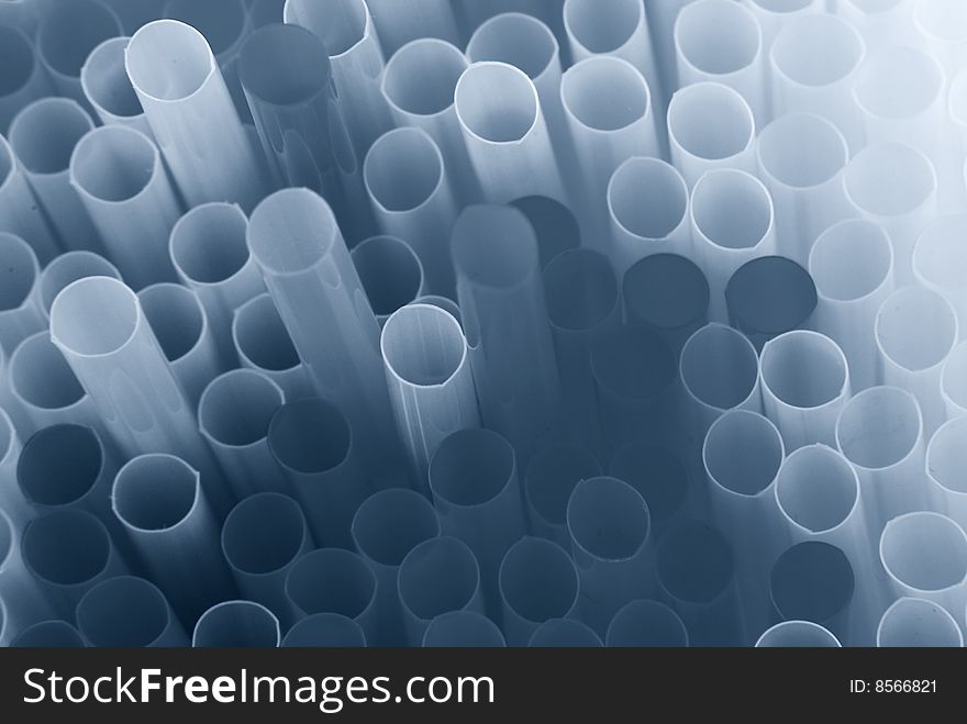 Blue toned abstract pattern of drinking straws. Blue toned abstract pattern of drinking straws