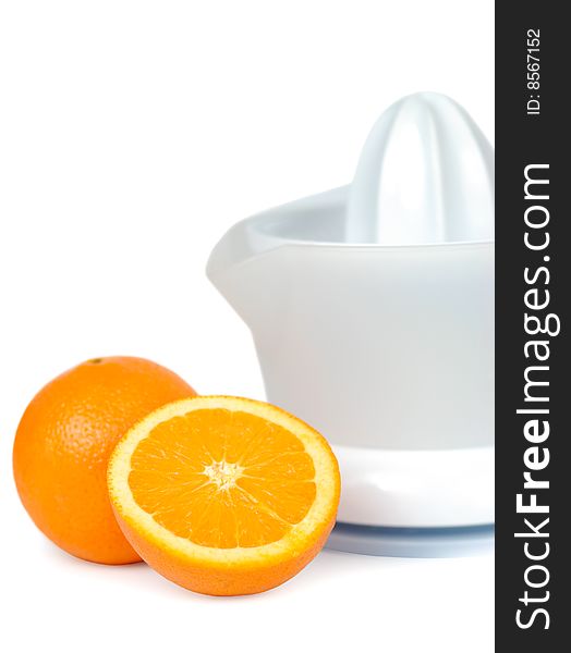 One and a half oranges with juicer isolated over white. One and a half oranges with juicer isolated over white