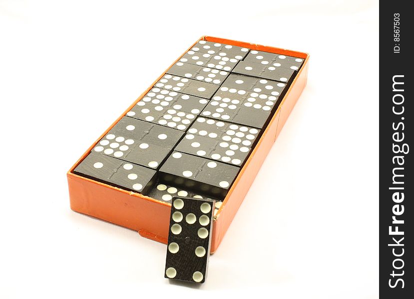 Box of dominoes isolated on a white background.