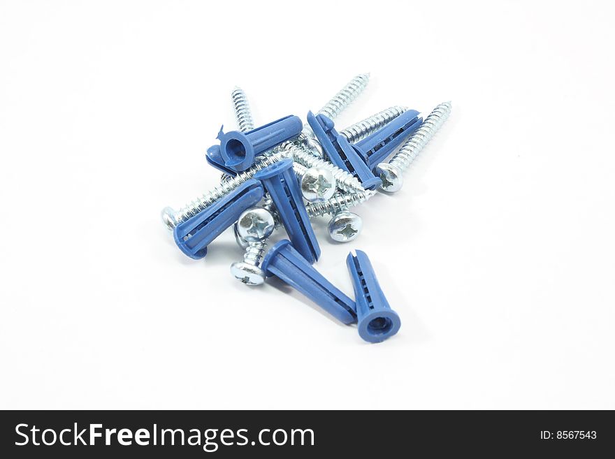 Screws and wall anchors isolated on white background.