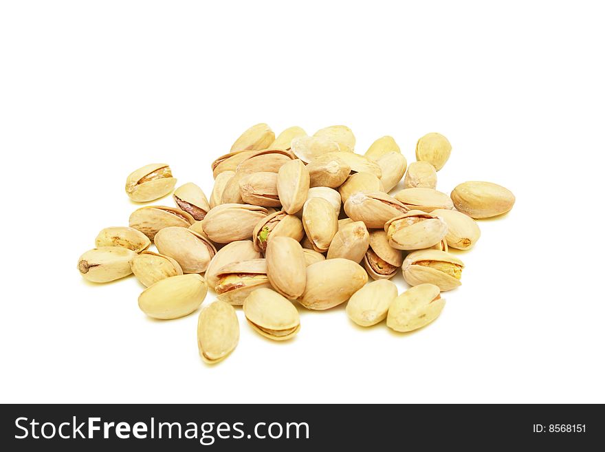 Pile of pistachio nuts isolated on white. Pile of pistachio nuts isolated on white.