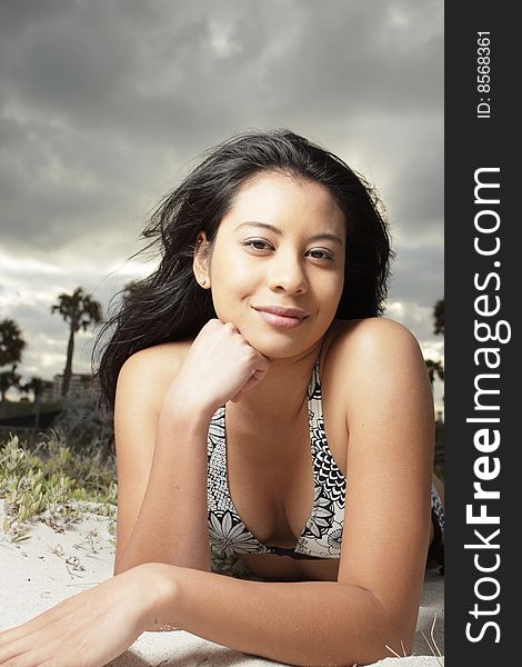 Attractive young woman relaxing on the beach. Attractive young woman relaxing on the beach