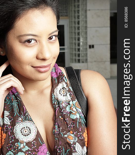 Headshot of a young brunette woman smiling. Headshot of a young brunette woman smiling