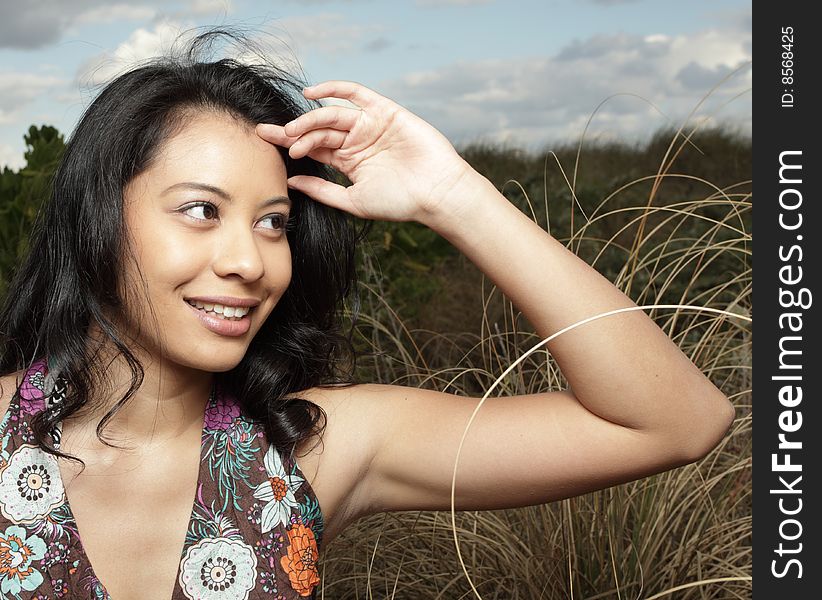 Young woman with her hand by her face. Young woman with her hand by her face