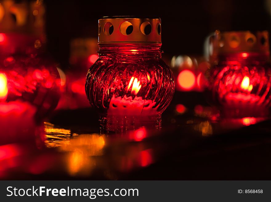 Red candle lights on dark background