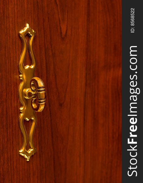 Retro gold handle on wooden door, abstract background. Retro gold handle on wooden door, abstract background