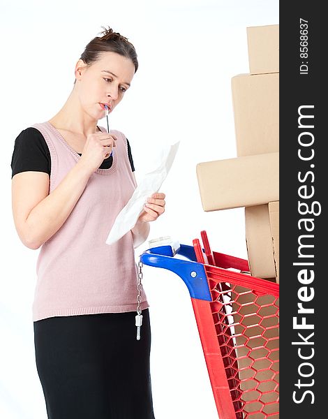 A woman checking her shopping receipt on white. A woman checking her shopping receipt on white