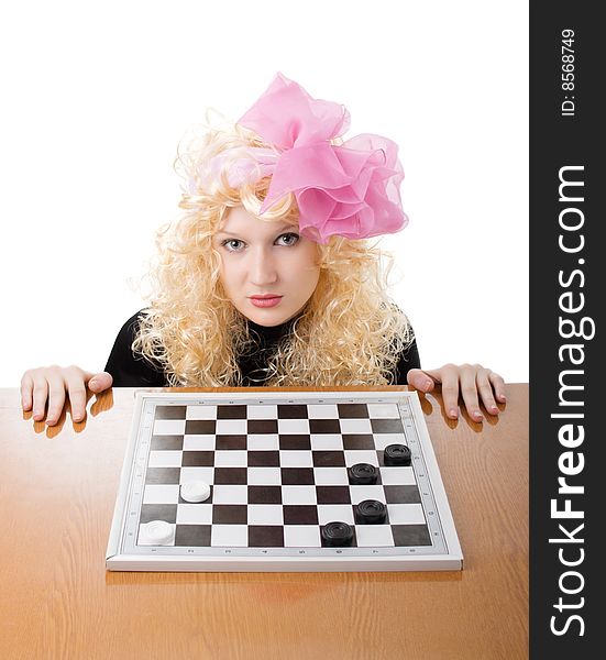 A glamor blonde plays a chess. A glamor blonde plays a chess