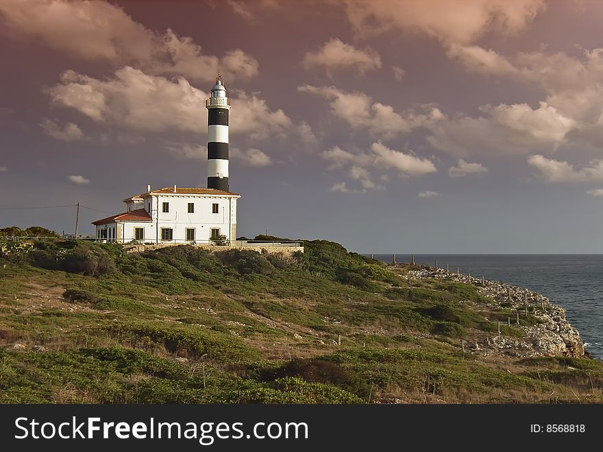 Mediterranean Lighthouse At Sunset