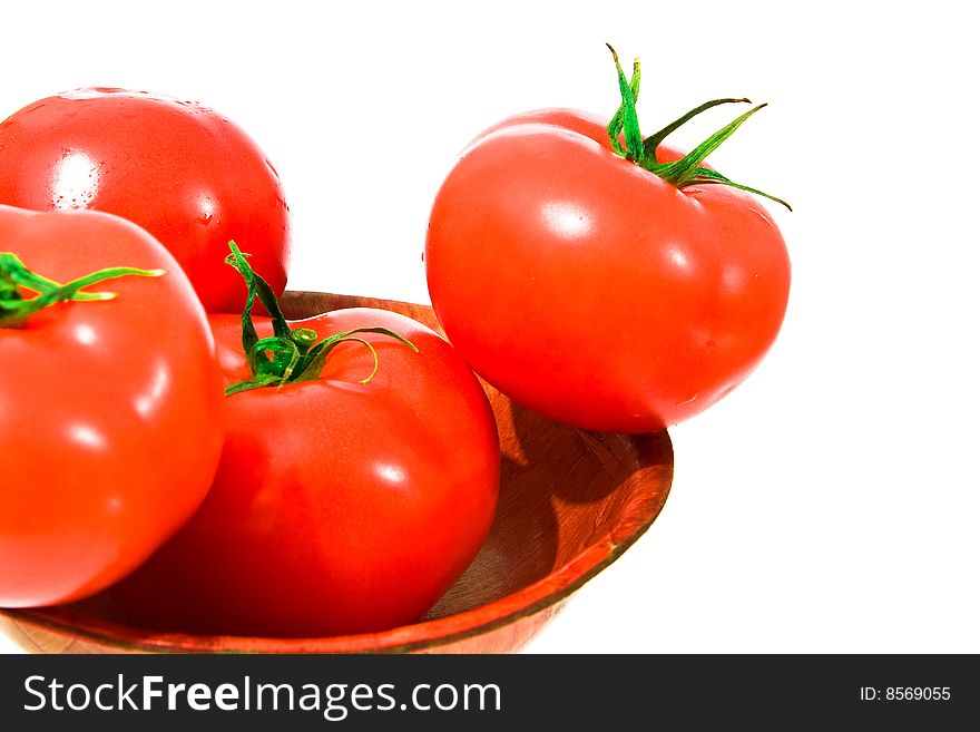 Several red and big tomato in bowl. isolated. Several red and big tomato in bowl. isolated.