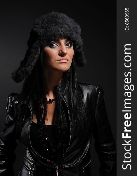 Woman in a fancy russian hat over black