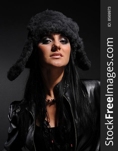 Woman in a fancy russian hat over black