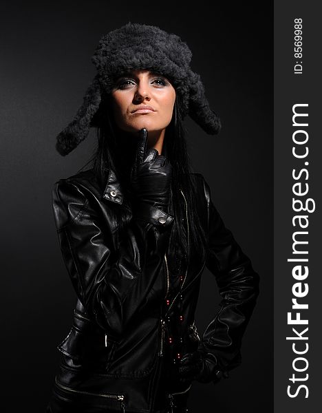 Woman in a fancy russian hat over black