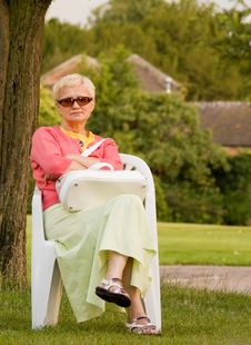 Woman In The Chair Royalty Free Stock Image