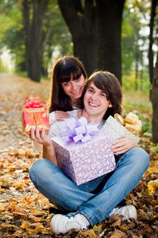 Young Couple With Gift Boxes Stock Photos Young Couple With Gift Boxes Stock Photos