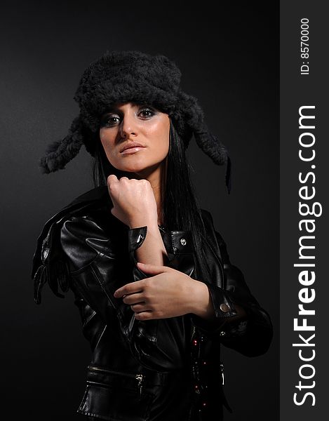 Woman in a fancy russian hat over black