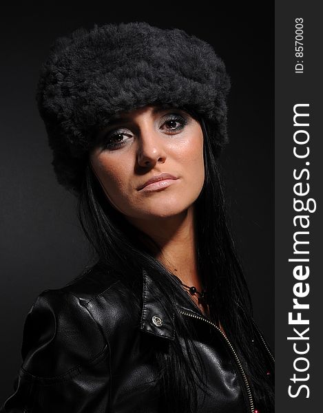 Woman in a fancy russian hat over black