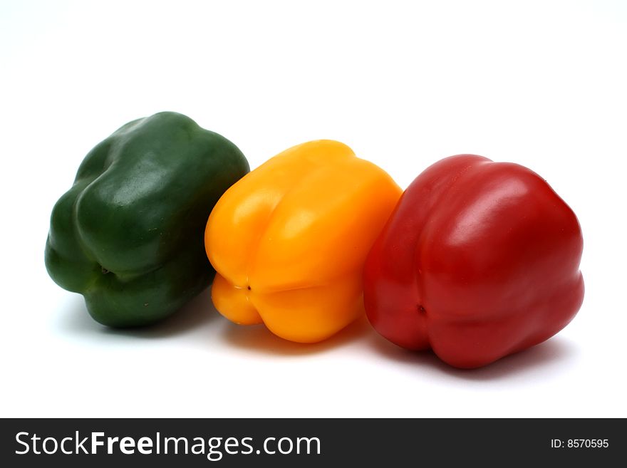 Three  colorful bell peppers.
Isolated on white background. Three  colorful bell peppers.
Isolated on white background.