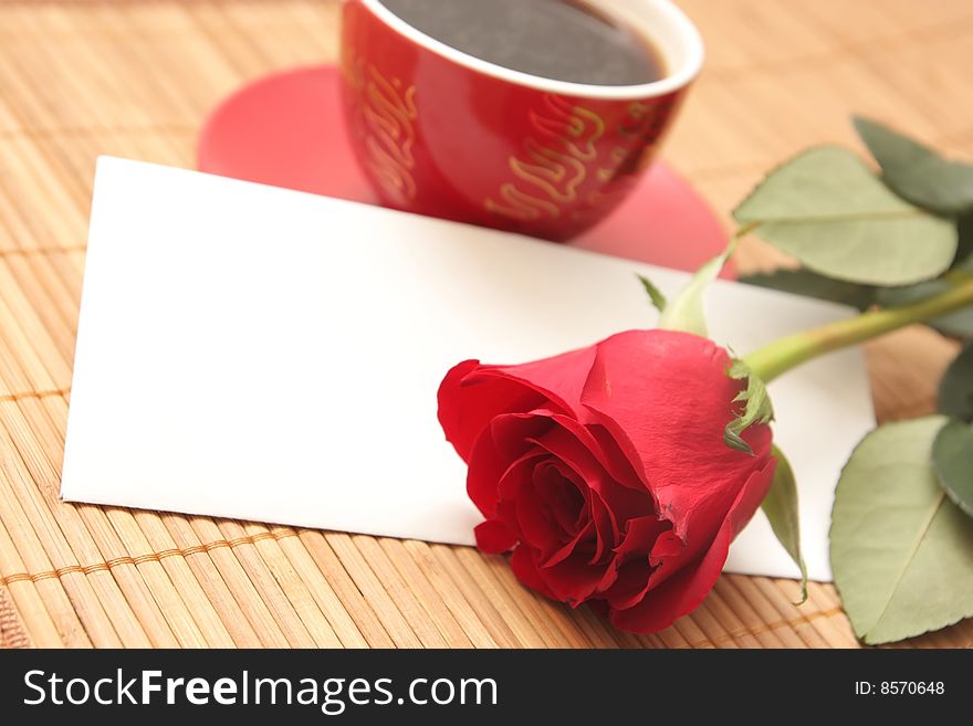 Still-life with a cup of coffee, a rose and the letter. Still-life with a cup of coffee, a rose and the letter