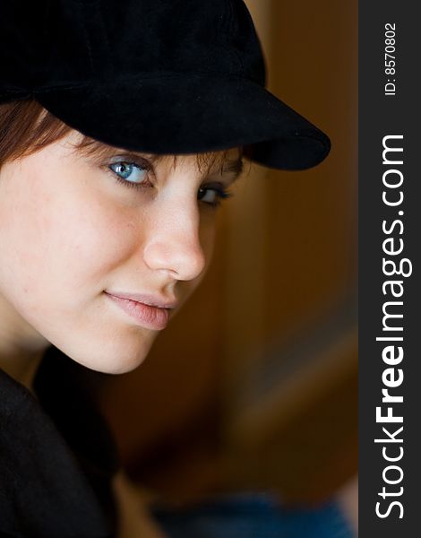 Beautiful girl in a stylish black cap. Beautiful girl in a stylish black cap